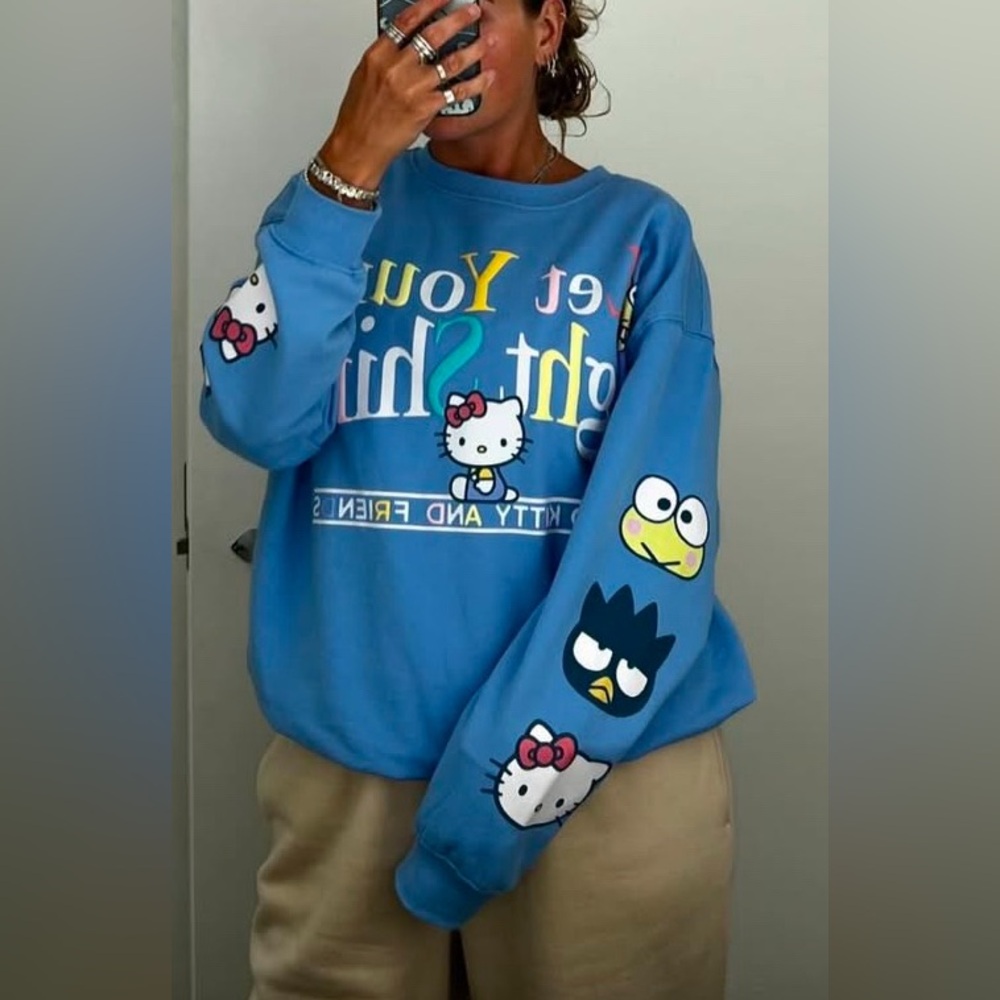 Hello Kitty Blue Sweatshirt with Character Graphics.